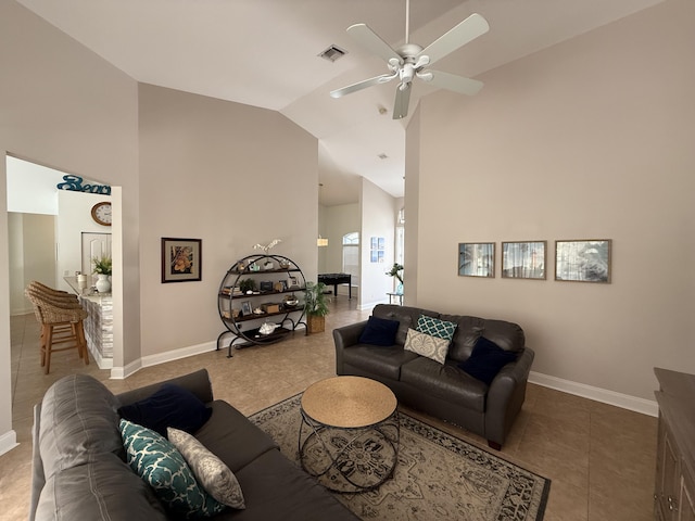 living room with ceiling fan, tile patterned floors, and high vaulted ceiling