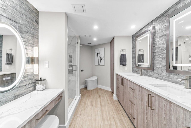 bathroom with vanity, an enclosed shower, tasteful backsplash, and toilet