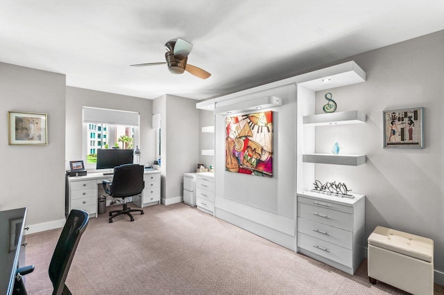 office space with ceiling fan and light carpet