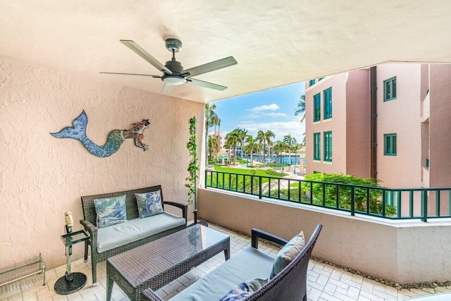 balcony with outdoor lounge area and ceiling fan