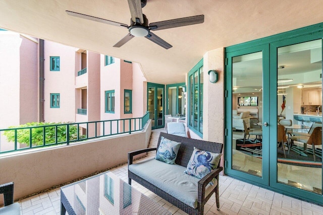 balcony with french doors and ceiling fan