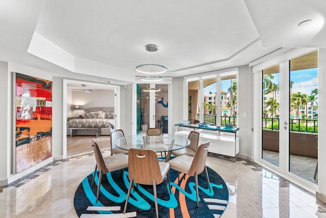 dining room with a notable chandelier and french doors