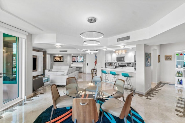 dining space with sink