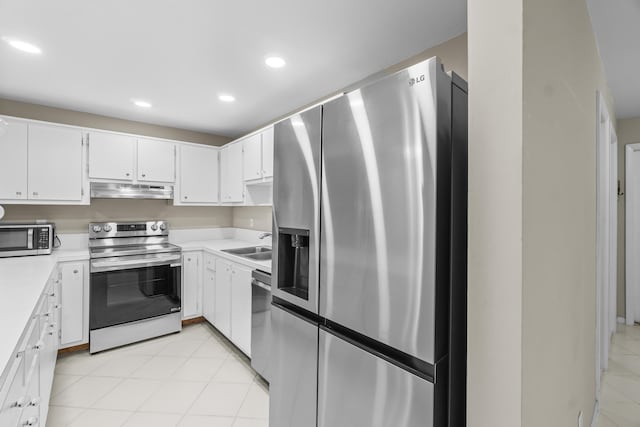 kitchen featuring appliances with stainless steel finishes, sink, and white cabinets