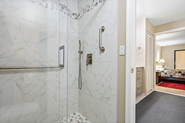 bathroom with a shower with shower door