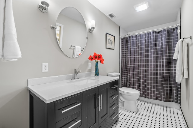 bathroom with tile patterned floors, vanity, toilet, and a shower with shower curtain