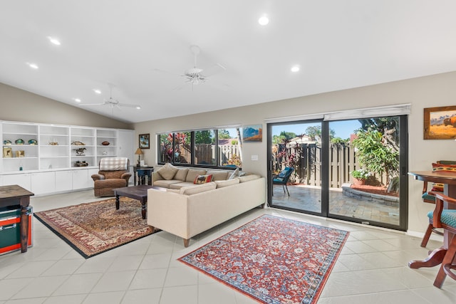 living room featuring light tile patterned floors, plenty of natural light, ceiling fan, and vaulted ceiling