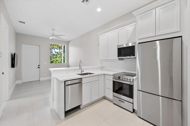 kitchen with white cabinetry, appliances with stainless steel finishes, and sink