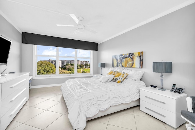 bedroom with crown molding, light tile patterned floors, and ceiling fan