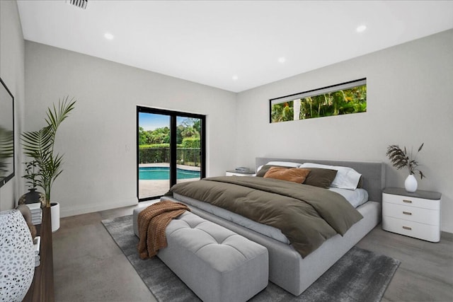 bedroom featuring concrete floors and access to outside