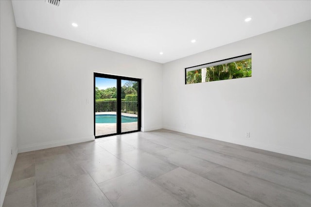 empty room featuring plenty of natural light