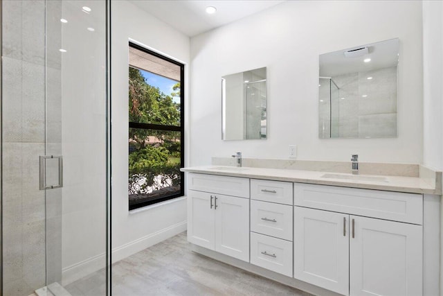 bathroom with vanity and an enclosed shower