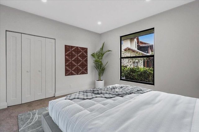 carpeted bedroom featuring a closet