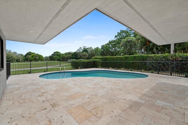 view of swimming pool featuring a patio area