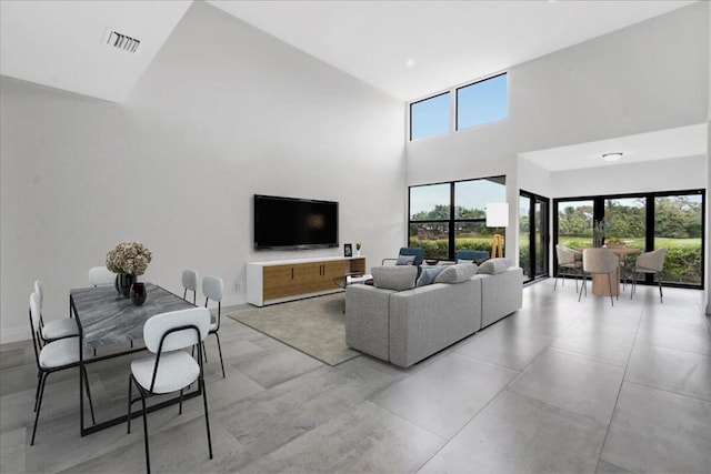 living room with a towering ceiling