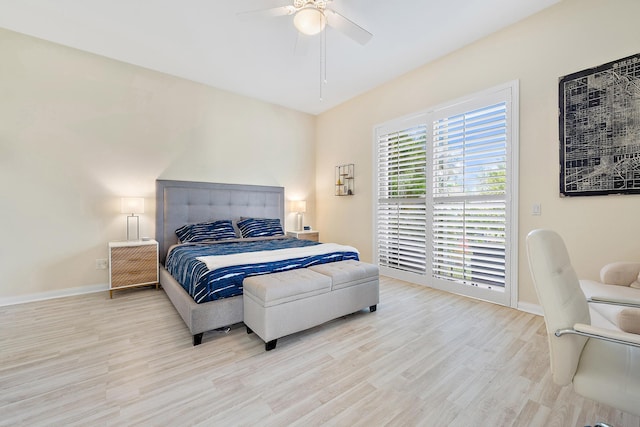 bedroom with ceiling fan and light hardwood / wood-style flooring