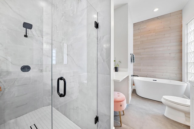 bathroom featuring plus walk in shower, wooden walls, and toilet