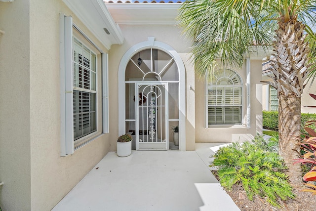 entrance to property with a patio