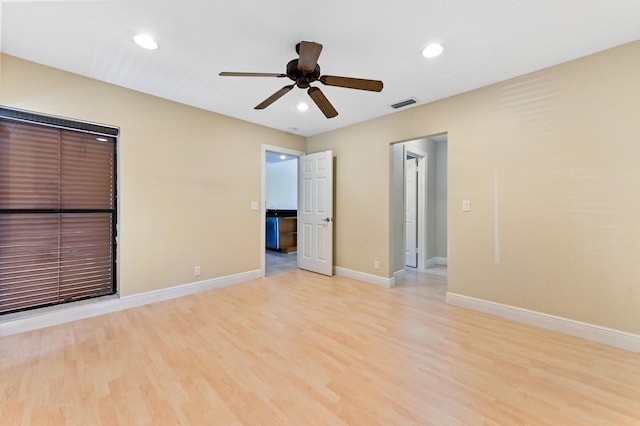 unfurnished room featuring light wood finished floors, recessed lighting, visible vents, a ceiling fan, and baseboards