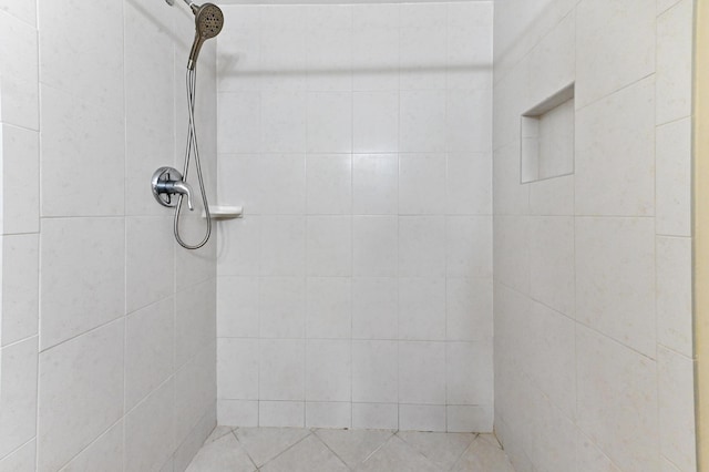 bathroom with a tile shower