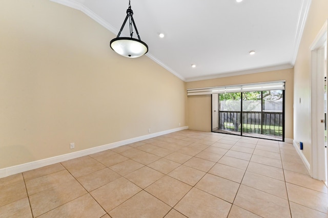 empty room with light tile patterned floors, vaulted ceiling, and ornamental molding