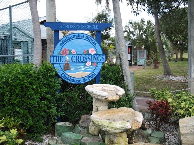 community sign featuring fence