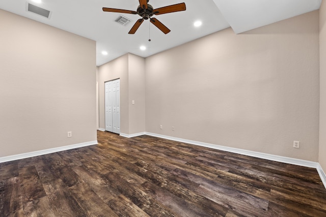 spare room featuring dark hardwood / wood-style flooring and ceiling fan