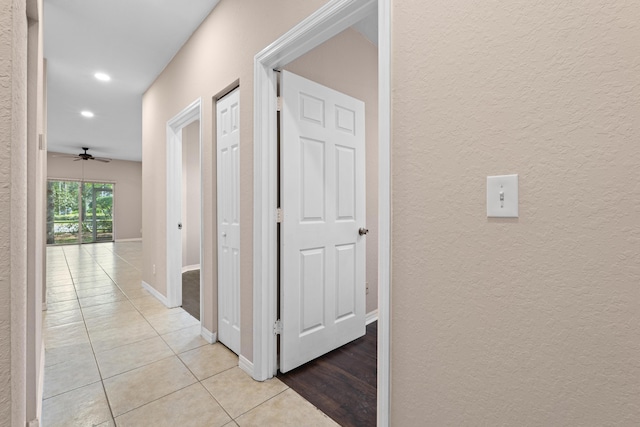 hallway with light tile patterned flooring