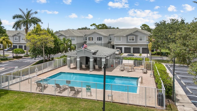 view of swimming pool featuring a patio area