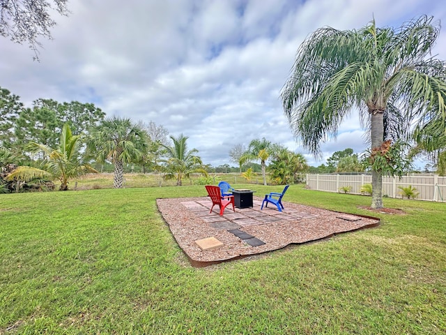 view of yard with a patio area and an outdoor fire pit