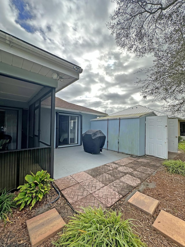 view of patio / terrace with a shed