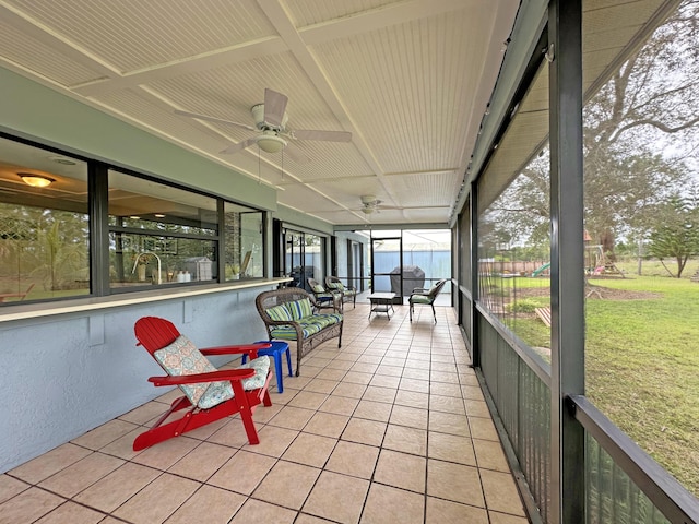 sunroom featuring ceiling fan