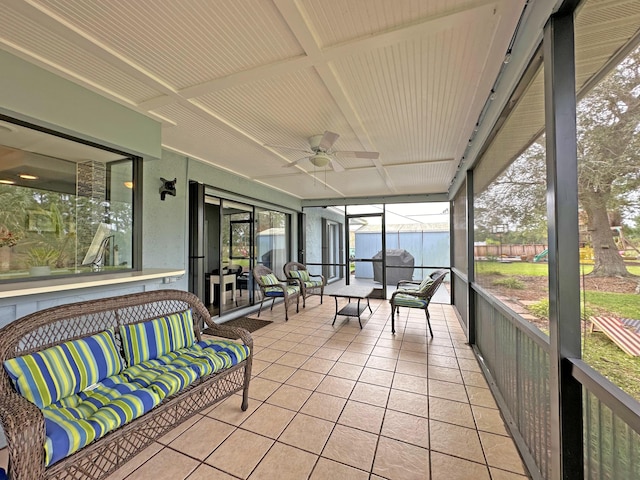 sunroom / solarium with ceiling fan