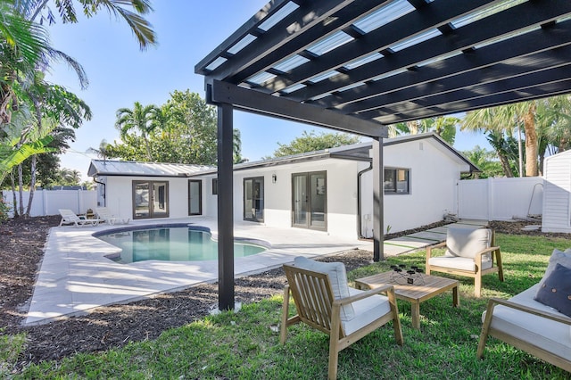 view of swimming pool with a patio, an outdoor structure, and a pergola