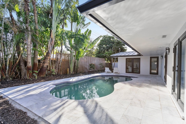 view of swimming pool featuring a patio