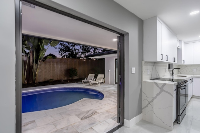 view of pool featuring sink