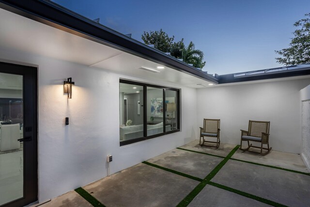 view of patio terrace at dusk