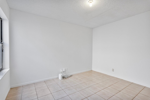 spare room featuring a textured ceiling