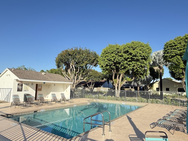 view of pool featuring a patio