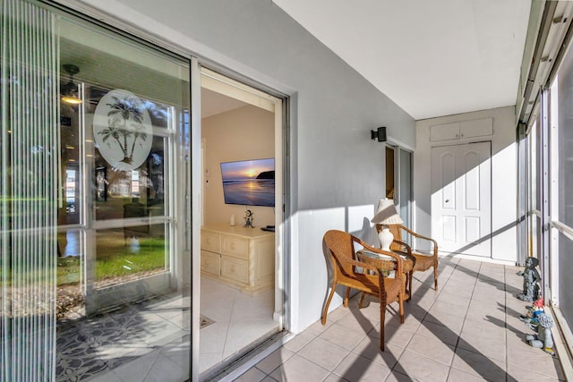 sunroom featuring a barn door