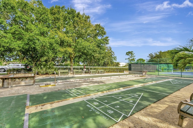 surrounding community featuring tennis court