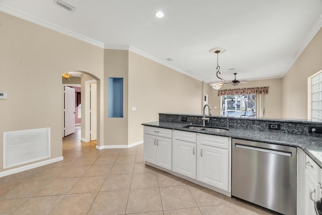 kitchen with sink, stainless steel dishwasher, white cabinets, and dark stone counters