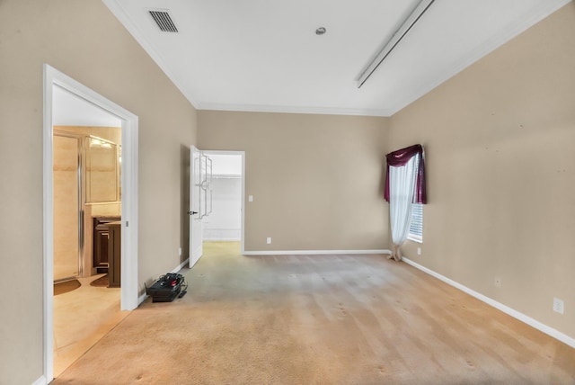 unfurnished room featuring ornamental molding and light colored carpet