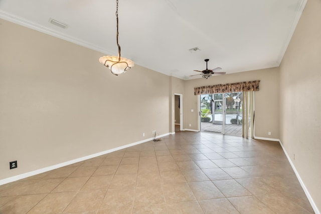 empty room with crown molding, light tile patterned floors, and ceiling fan