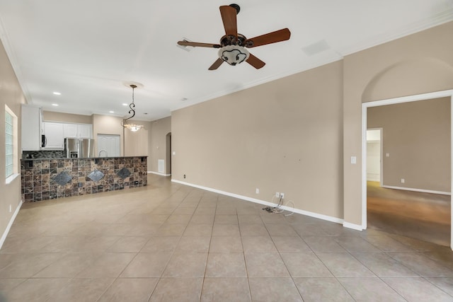 unfurnished living room featuring ornamental molding, ceiling fan, and light tile patterned flooring