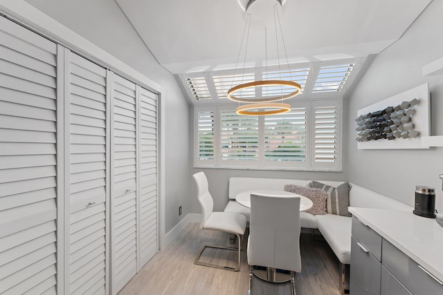 dining space featuring dark hardwood / wood-style flooring and breakfast area