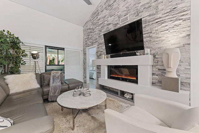 living room with high vaulted ceiling