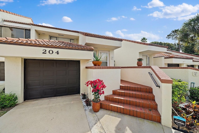 mediterranean / spanish-style home featuring a garage