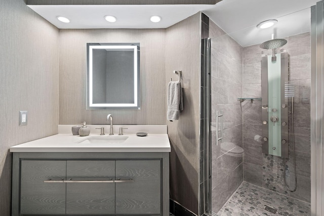 bathroom with vanity and an enclosed shower