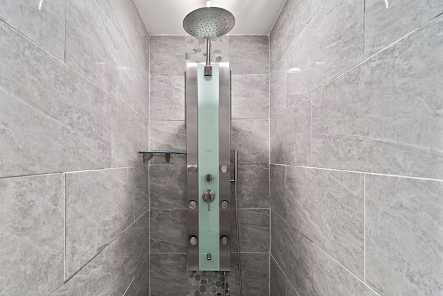 bathroom with tiled shower